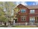 Charming two-story townhome featuring a well-maintained yard and inviting curb appeal with mature landscaping at 4061 Nordland Trl, Castle Rock, CO 80109