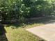 Backyard featuring a retaining wall, grass, and shrubs at 21300 E 42Nd Ave, Denver, CO 80249