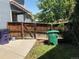 Backyard showcasing a wooden fence and trash receptacles at 21300 E 42Nd Ave, Denver, CO 80249