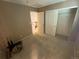 Neutral bedroom with an open closet, and an entrance to the stairway at 21300 E 42Nd Ave, Denver, CO 80249