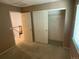 Neutral bedroom with a closet, and an entrance to the stairway at 21300 E 42Nd Ave, Denver, CO 80249