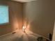 Cozy room featuring a decorative lamp next to a window and neutral walls at 21300 E 42Nd Ave, Denver, CO 80249