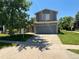 Charming home with a lush front yard and an attached two-car garage at 21300 E 42Nd Ave, Denver, CO 80249