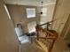 Spacious living room with high ceilings, natural light, and a modern staircase at 21300 E 42Nd Ave, Denver, CO 80249