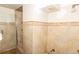 Bathroom in need of renovation showcasing beige tile and a partially installed shower at 415 Winona Ct, Denver, CO 80204