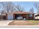 A single Gathering brick home with a one car garage in need of some TLC at 415 Winona Ct, Denver, CO 80204
