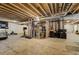 Large unfinished basement featuring exposed beams, perfect for converting into a rec room at 3940 Wynwood Cir, Highlands Ranch, CO 80126