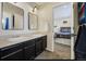 Dual sinks and modern fixtures make this shared bathroom functional and stylish at 3940 Wynwood Cir, Highlands Ranch, CO 80126