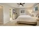 The bedroom has a full bathroom and ample lighting at 66 Yank Way, Lakewood, CO 80228