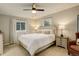 A bright bedroom with neutral colors, large windows, and soft carpet at 66 Yank Way, Lakewood, CO 80228