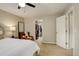 The bedroom features a walk in closet and ample lighting at 66 Yank Way, Lakewood, CO 80228