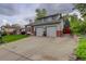 The home features an attached two-car garage and a driveway for additional parking at 66 Yank Way, Lakewood, CO 80228