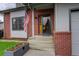 Welcoming front entrance with an American flag and planter at 66 Yank Way, Lakewood, CO 80228