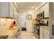 Modern kitchen with stainless steel appliances and granite countertops at 66 Yank Way, Lakewood, CO 80228