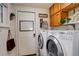 Functional laundry room equipped with a washer and dryer at 66 Yank Way, Lakewood, CO 80228