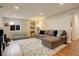 This living room features a sectional couch and ample lighting at 66 Yank Way, Lakewood, CO 80228