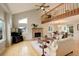 Spacious living room with a vaulted ceiling, a fireplace, and hardwood floors at 66 Yank Way, Lakewood, CO 80228