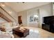Comfortable living room with large window providing natural light at 66 Yank Way, Lakewood, CO 80228