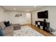 The living room offers stylish, comfortable seating and a modern entertainment center at 66 Yank Way, Lakewood, CO 80228