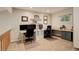Dedicated home office features built-in desk and shelving with natural light at 66 Yank Way, Lakewood, CO 80228