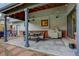 Outdoor patio with stone pavers, outdoor dining, and outdoor lighting for evening enjoyment at 66 Yank Way, Lakewood, CO 80228