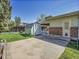 Landscaped backyard featuring a shed, patio, fence, and well-maintained lawn, ideal for outdoor living at 5225 Beech St, Arvada, CO 80002