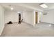 Spacious finished basement offers versatile living space with neutral carpet and ample lighting at 5225 Beech St, Arvada, CO 80002