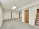Finished basement featuring neutral carpet and open layout, perfect for recreation or storage at 5225 Beech St, Arvada, CO 80002