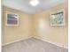 Cozy bedroom featuring neutral carpeting, light-colored walls, and double windows at 5225 Beech St, Arvada, CO 80002