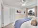 Bright bedroom featuring a comfortable bed, large window, closet, and neutral decor at 5225 Beech St, Arvada, CO 80002