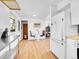 Open concept kitchen with stainless steel island, and dining area with table and chairs at 5225 Beech St, Arvada, CO 80002