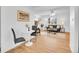 Sun-filled living room featuring light hardwood floors, modern furniture, and contemporary decor at 5225 Beech St, Arvada, CO 80002