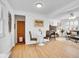 Open living room showcases hardwood floors, a cozy fireplace, and neutral decor at 5225 Beech St, Arvada, CO 80002