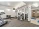 Well-equipped gym with treadmills, weights, and mirrors for a complete fitness experience at 3470 S Poplar St # 102, Denver, CO 80224