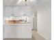 A kitchen featuring white cabinetry and appliances at 3470 S Poplar St # 102, Denver, CO 80224