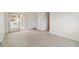 Bright open concept living room with sliding glass door to a balcony at 3470 S Poplar St # 102, Denver, CO 80224