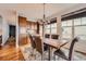 Inviting dining room with wood table, custom cabinets, and natural light at 7892 S Country Club Pkwy, Aurora, CO 80016