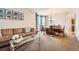 Cozy living room with plush sofa, decorative coffee table, and dining area at 7892 S Country Club Pkwy, Aurora, CO 80016