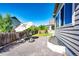 Backyard patio features a fire pit, seating, landscaping, and privacy fence at 3966 Long Rifle Dr, Castle Rock, CO 80108
