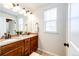 Bathroom featuring granite countertops, double sinks, and a tiled backsplash at 3966 Long Rifle Dr, Castle Rock, CO 80108