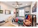 Fun bedroom featuring colorful bedding, wall decor and a ceiling fan at 3966 Long Rifle Dr, Castle Rock, CO 80108