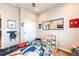 bedroom featuring neutral paint, ceiling fan, and fun marvel decorations at 3966 Long Rifle Dr, Castle Rock, CO 80108