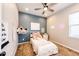 Charming bedroom with a cozy bed, fun decor, and a calming color palette at 3966 Long Rifle Dr, Castle Rock, CO 80108