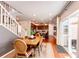 Open floor plan with a wood dining table adjacent to the kitchen and sliding glass door at 3966 Long Rifle Dr, Castle Rock, CO 80108