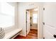 Bright entryway featuring a built-in bench, coat hooks, and hardwood flooring at 3966 Long Rifle Dr, Castle Rock, CO 80108