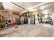 Spacious garage with storage cabinets, tool bench, and organization at 3966 Long Rifle Dr, Castle Rock, CO 80108