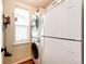Functional laundry area with stackable washer/dryer and a window for natural light at 3966 Long Rifle Dr, Castle Rock, CO 80108