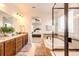 Luxurious main bathroom with a double vanity, soaking tub, and glass-enclosed shower at 3966 Long Rifle Dr, Castle Rock, CO 80108