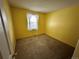 Bright bedroom with carpeted floor and a window at 17422 E Progress Dr, Centennial, CO 80015