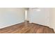 Bedroom with hardwood floors and closet at 6051 Ivanhoe St, Commerce City, CO 80022